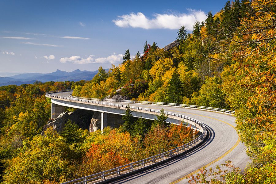 About Our Agency - Landscape View of a Curved Road in the Appalachian Mountains on the Blue Ridge Parkway Linn Cove Viaduct in North Carolina